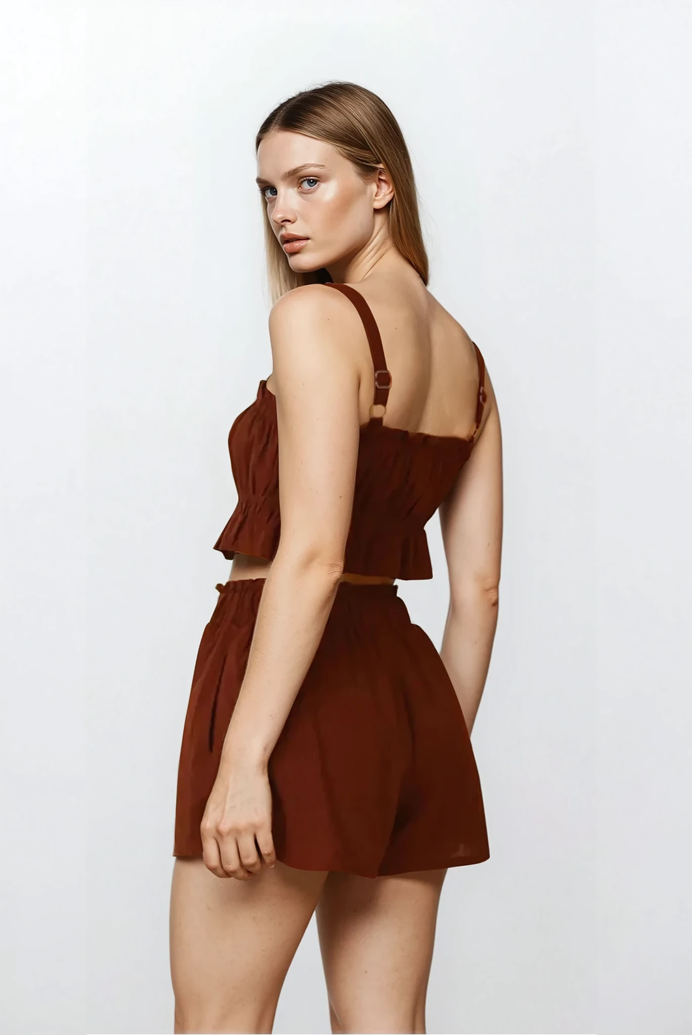 Ines Ruffle Square Neck Cami and Short Set by Trendsi, featuring a light-colored ruffled cami top and matching shorts on a model.