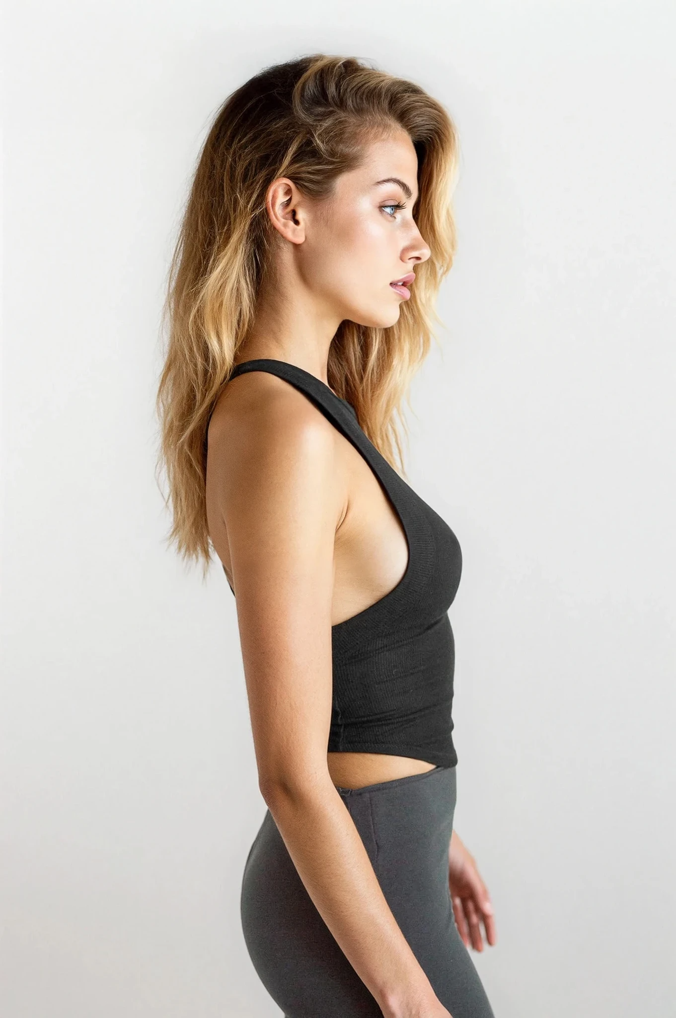 Light gray rib-knit sleeveless cropped tank top with halter neck from Trendsi, casual everyday clothing for warm weather.