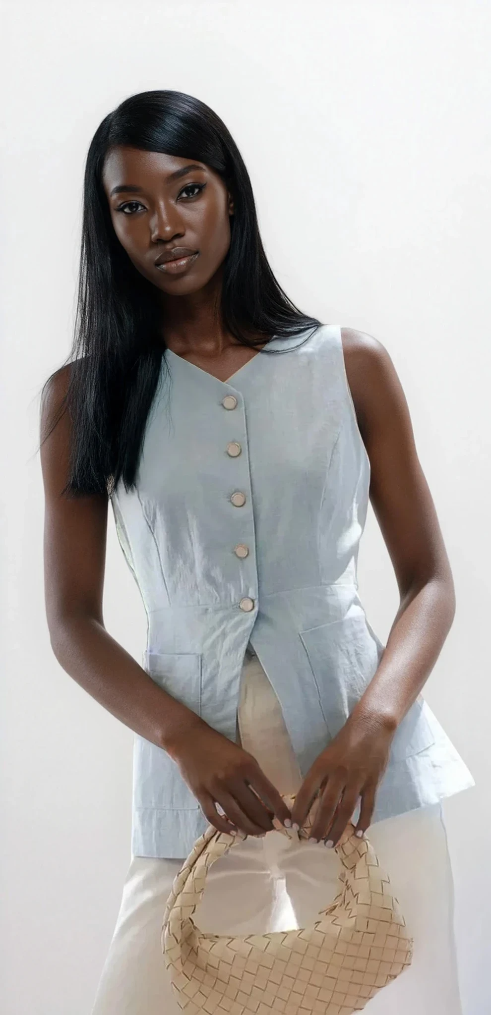 Light-colored Trace Button Down V-Neck Vest by Trendsi, shown on a model, featuring a sleek button-up design and V-neck style.