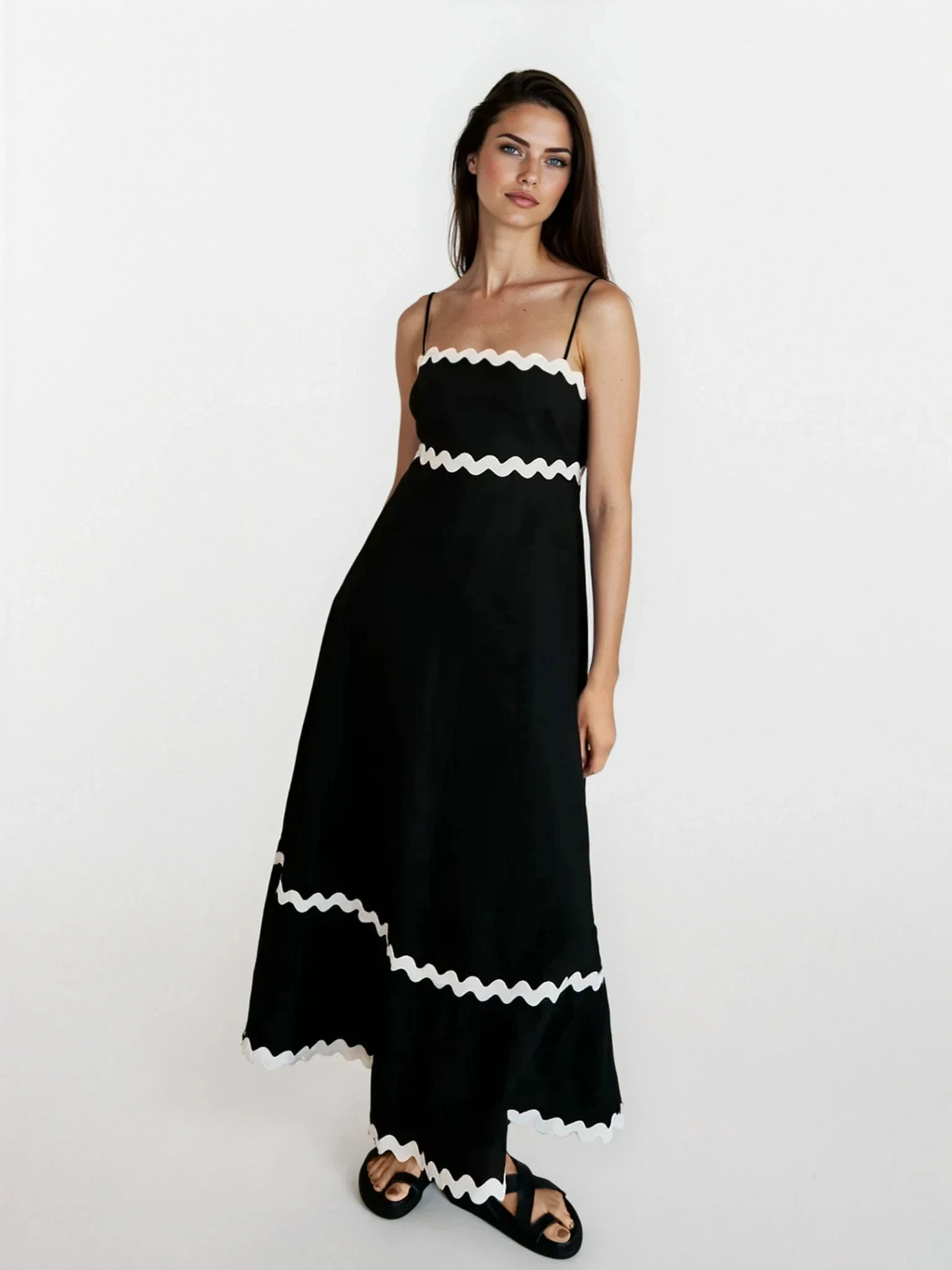 Tidal spaghetti strap maxi dress by Trendsi featuring a flowy silhouette and light fabric, perfect for warm weather.