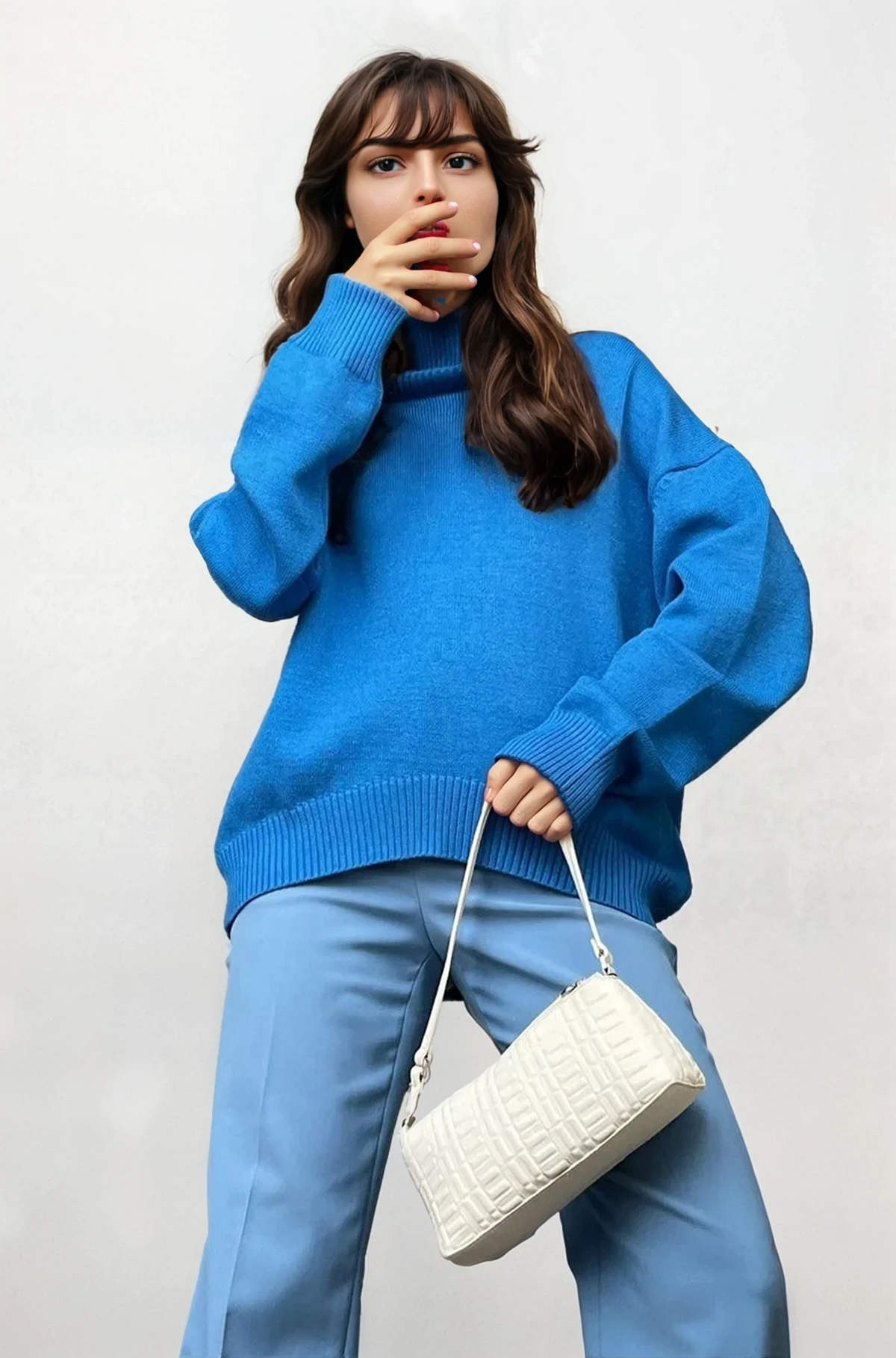 woman wearing effortless turtleneck dropped shoulder sweater