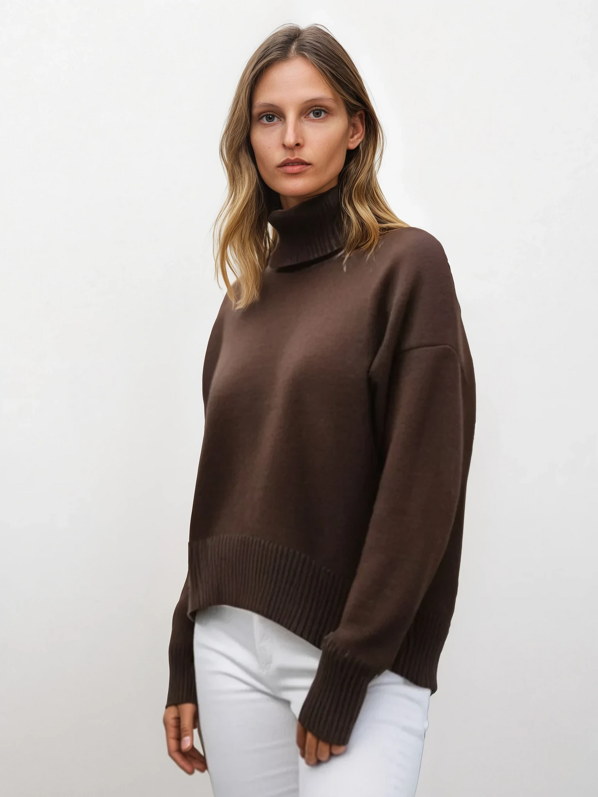 woman wearing effortless turtleneck dropped shoulder sweater