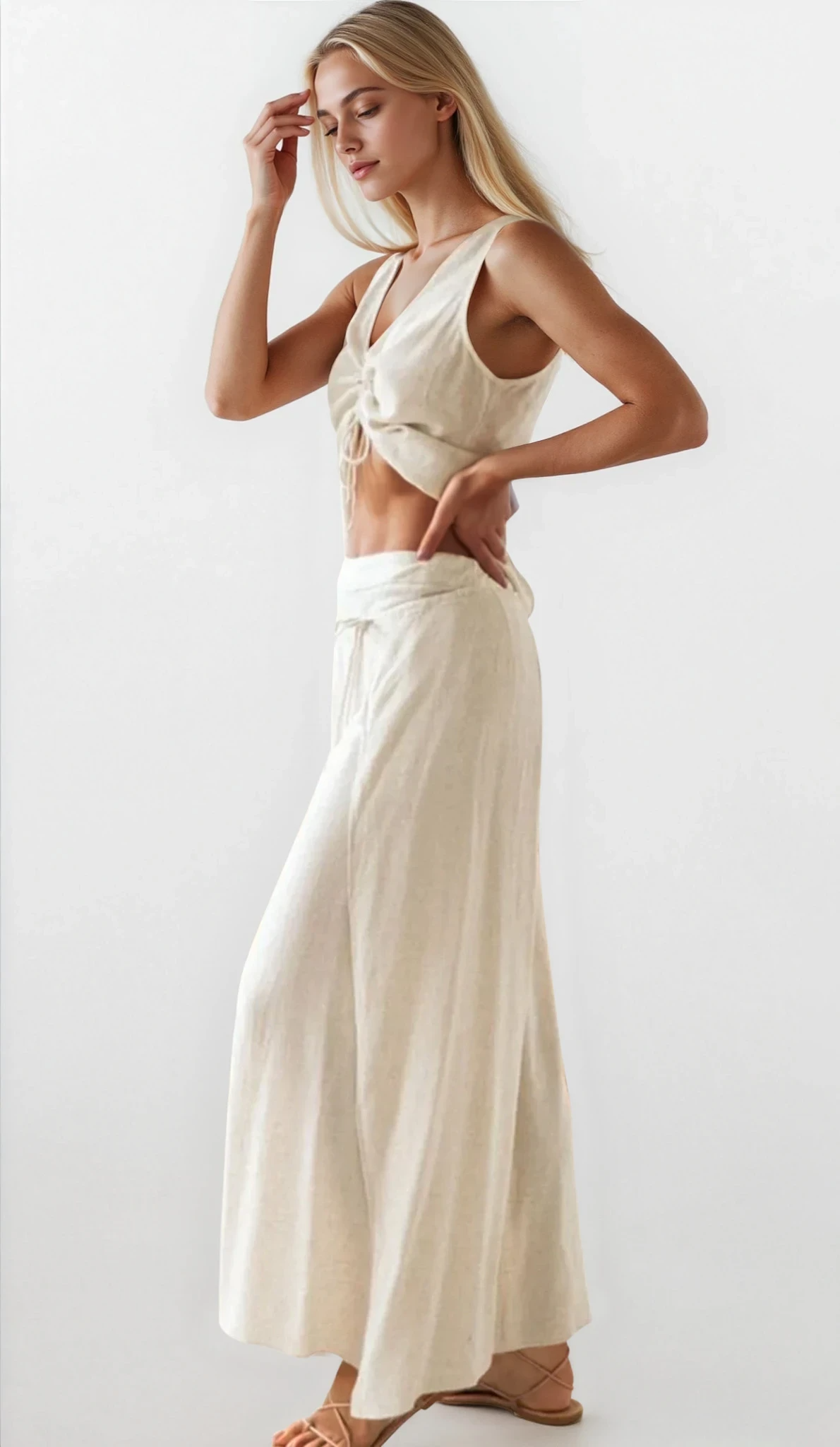 Light-colored V-neck tank and matching pants set by Trendsi, casual clothing ensemble with relaxed fit and comfortable fabric.