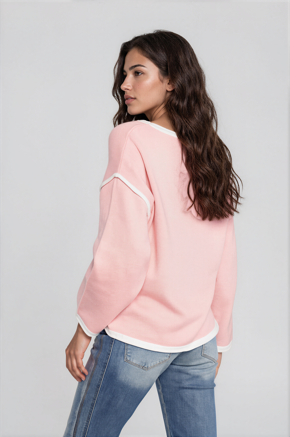 Halo Contrast Detail Dropped Shoulder Knit Top in pale pink with white contrast trim, a ribbed texture, and relaxed long sleeves